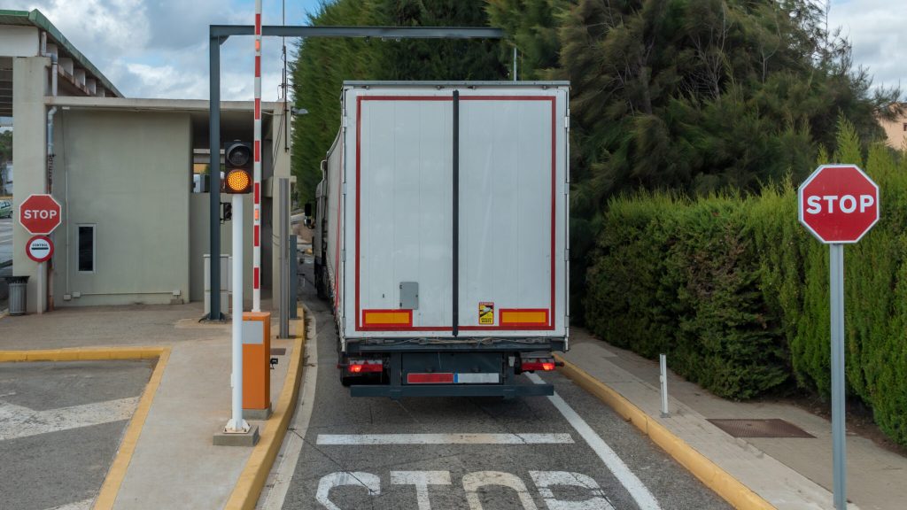 Truck stopped at a port customs waiting for authorization to continue circulating.